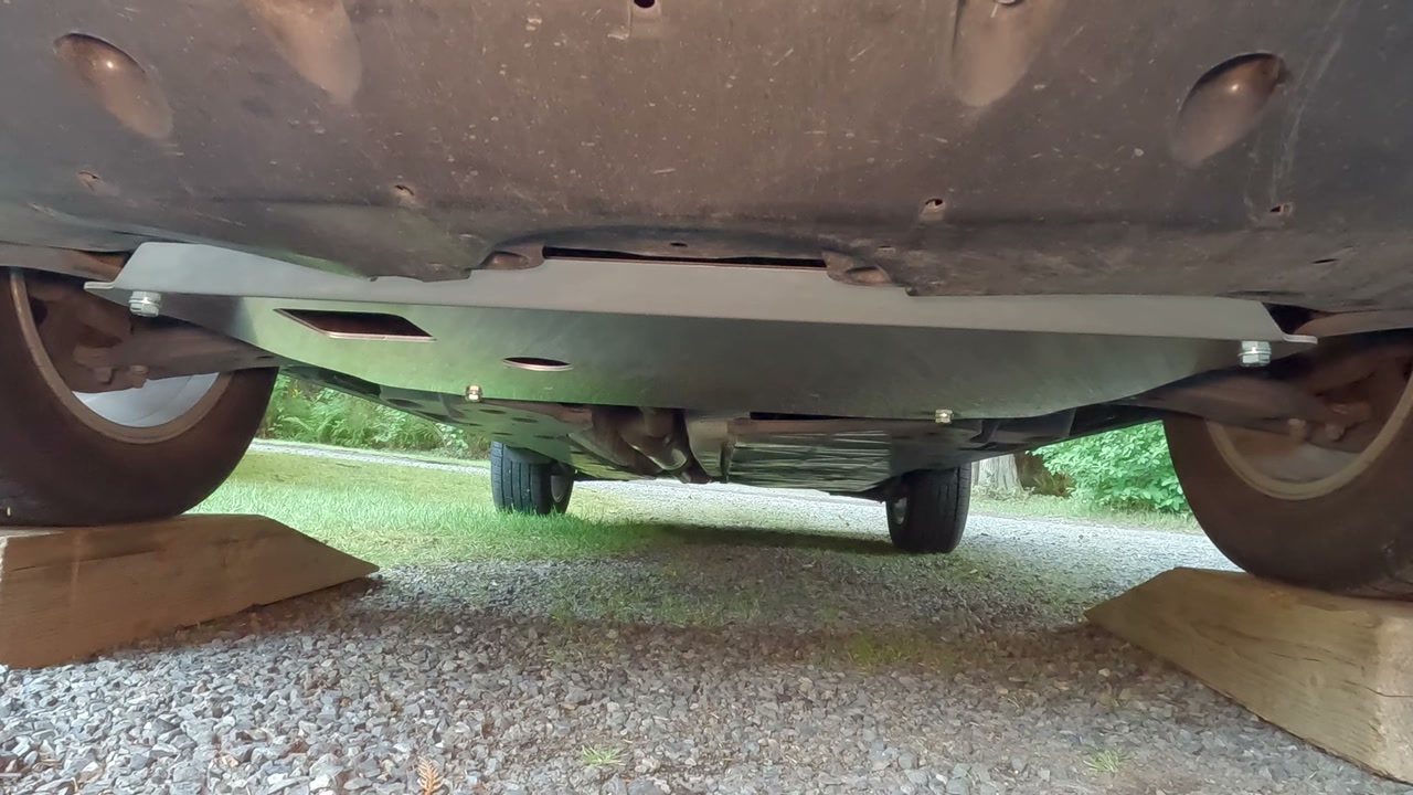 The underside of a 2021 RAV4 with an LP Aventure aluminum front skid plate just installed