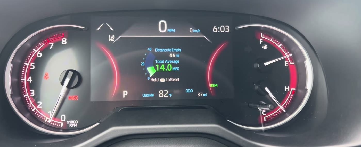 The 7-inch gauge screen of a 2025 gas RAV4 with Meter Type set to Digital, showing the speed as a big number at the top of the middle screen, with the tachometer on the left and the fuel and temperature gauges on the right