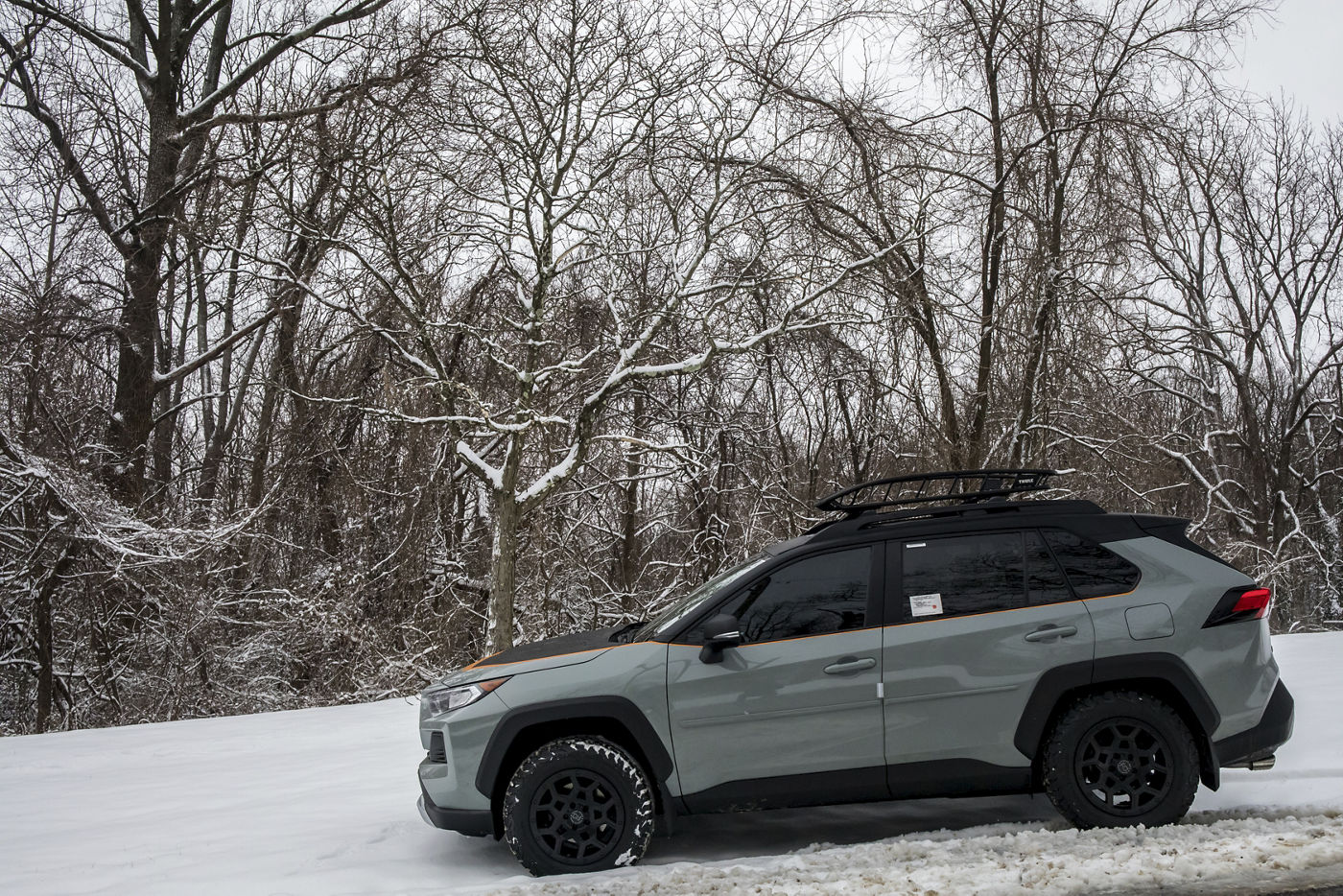 Side view of the RAV4 on Black Rhino Overland wheels in the snow
