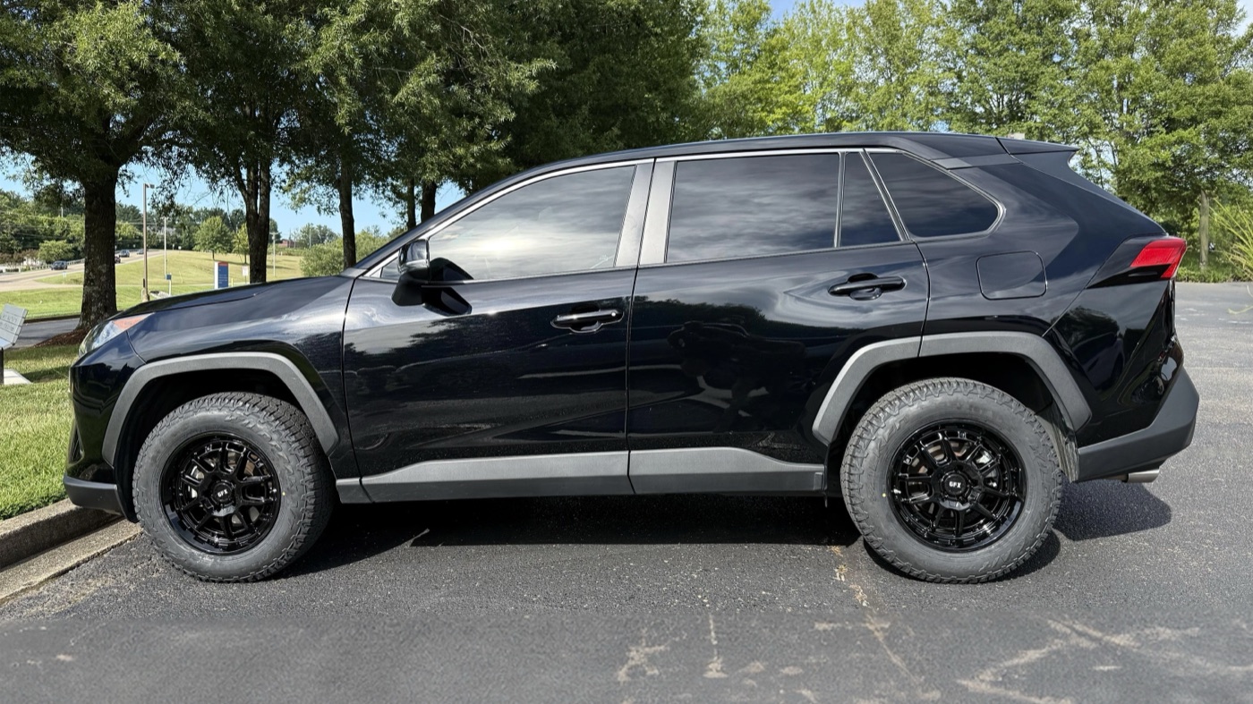 A black 2022 RAV4 on gloss black G-FX TR34 wheels