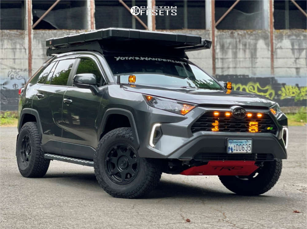 A Magnetic Gray 2020 RAV4 on black Gear Off-Road Barricade 16-inch wheels and Falken Wildpeak A/T3W tires in 255/70R16, with a rooftop tent and red skid plate