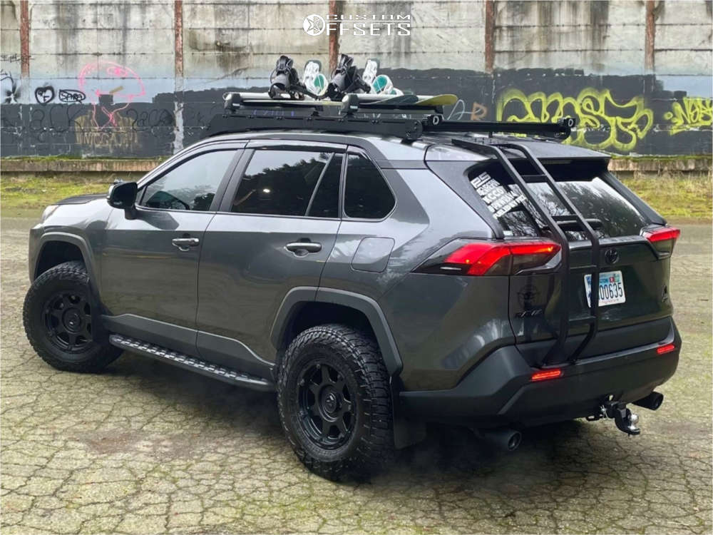 Rear view of the same RAV4 showing the wheels sitting outside the fenders