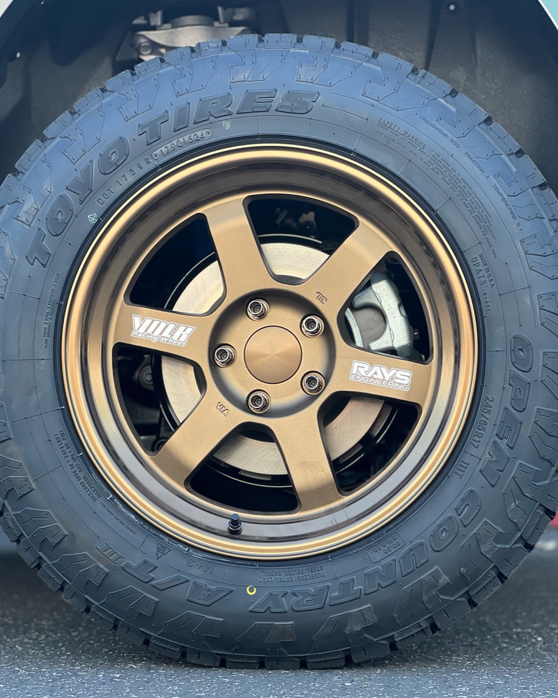 Close-up of the bronze Volk TE37 wheel and Toyo Open Country A/T III tire