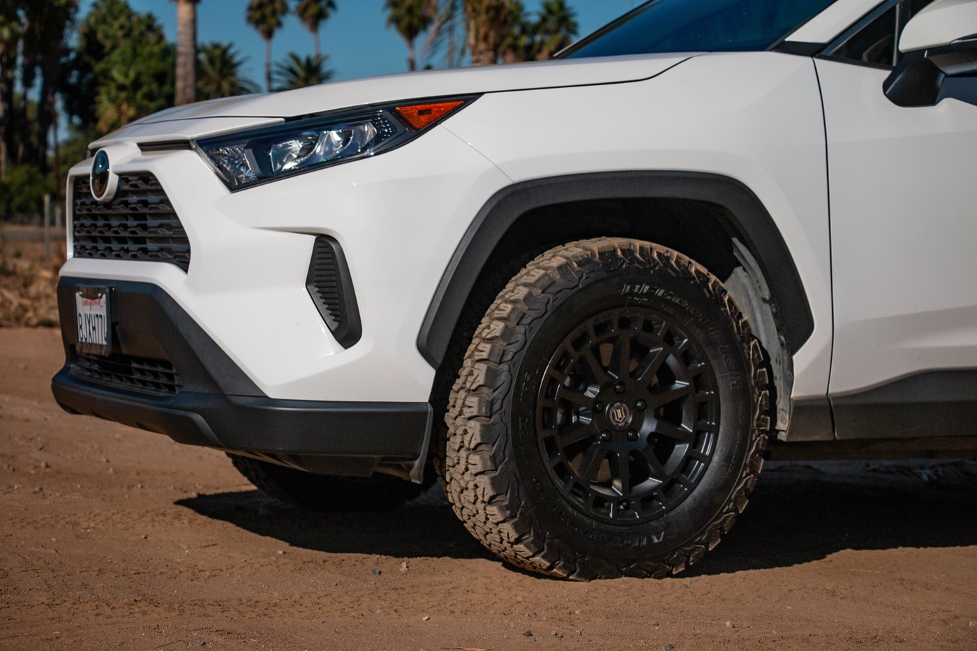 A white 2019 RAV4 on satin black Icon Alloys Journey wheels and BFGoodrich KO2 tires