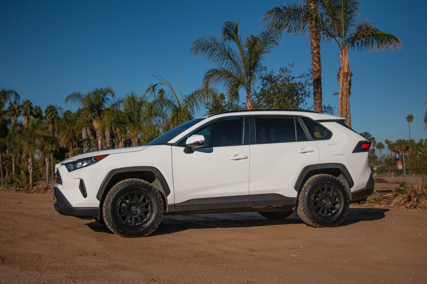A white 2019 RAV4 on satin black Icon Alloys Ricochet wheels and BFGoodrich KO2 tires