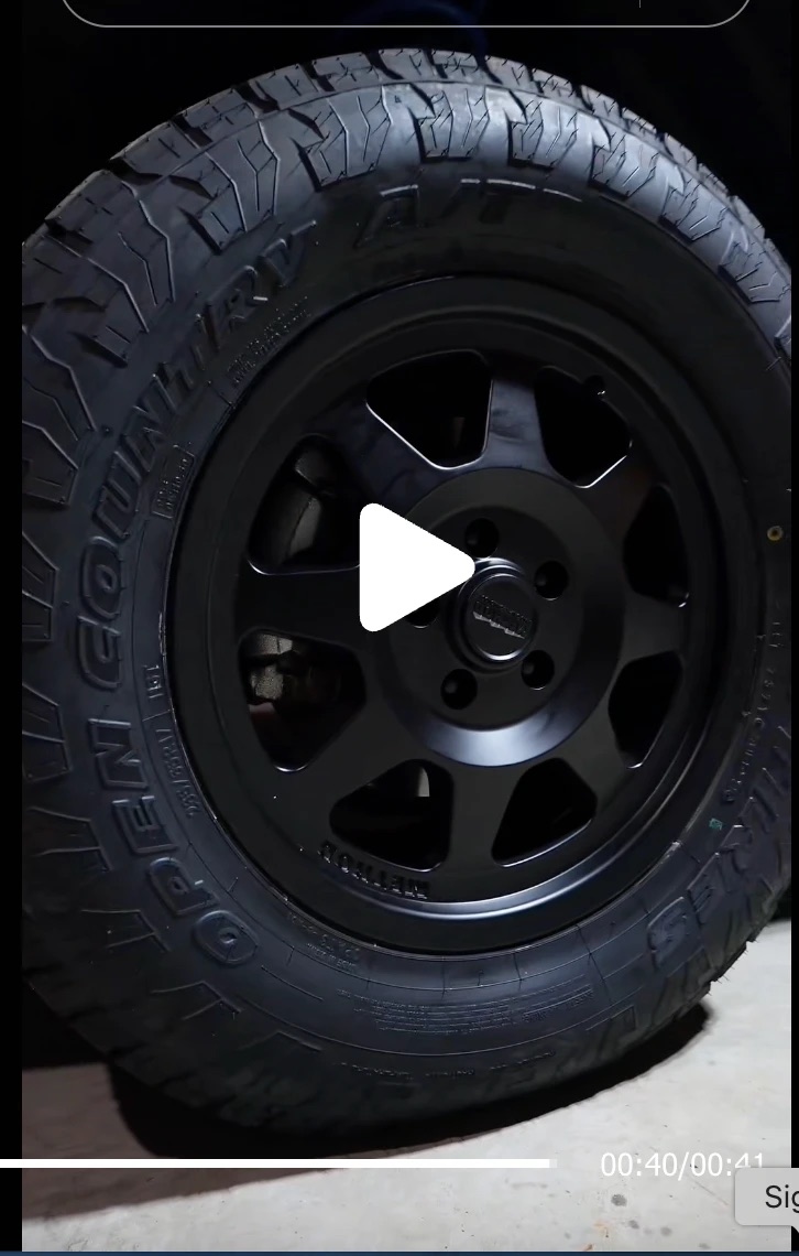 A matte black Method MR701 wheel with a Toyo Open Country A/T III tire in 265/65R17