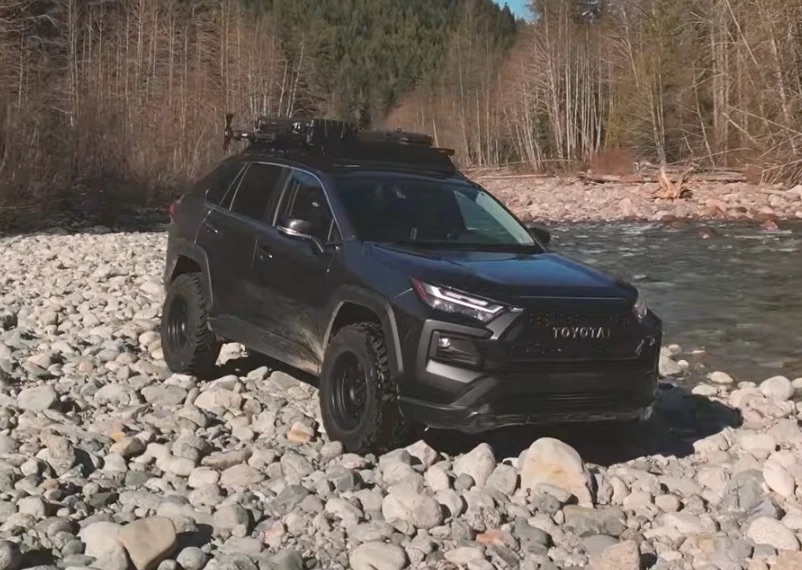 The lifted RAV4 on Toyo Open Country M/T tires on a riverbank